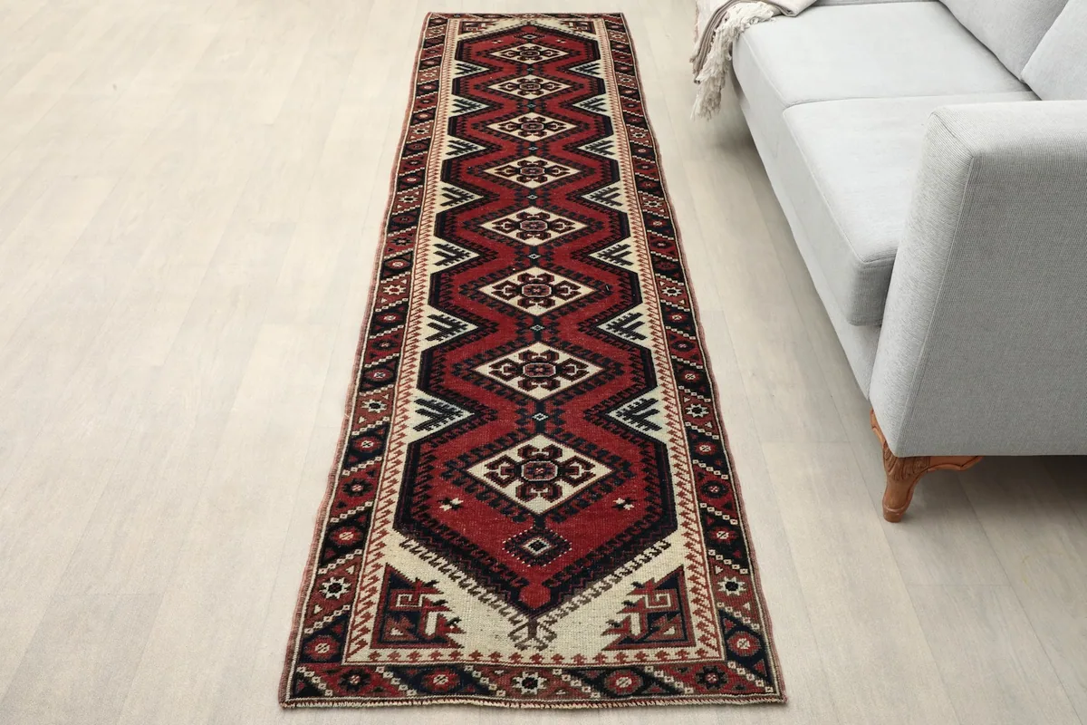 Vintage runner rug in a modern living space with a light gray sofa