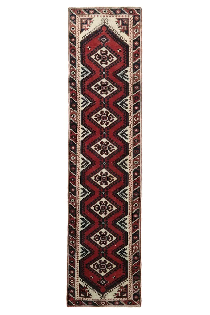 Overhead view of the Anatolian runner rug with its distinctive red and ivory patterns