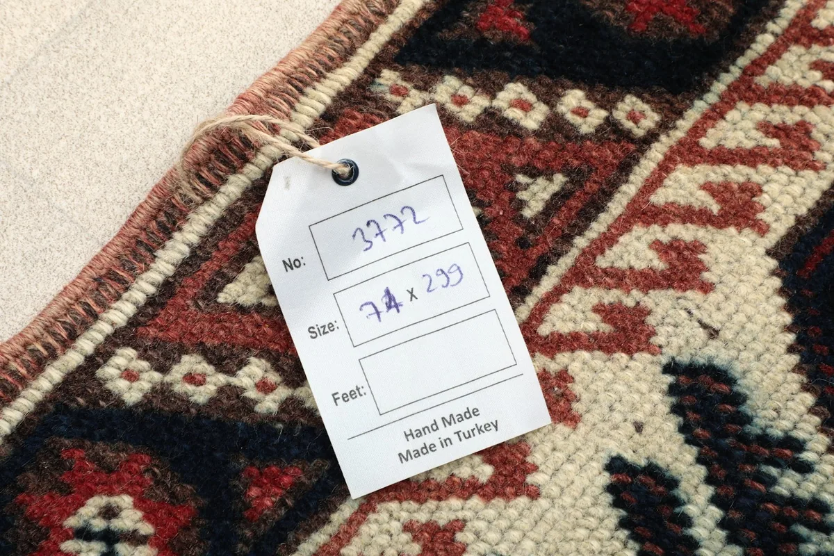 Identification tag on the rug, confirming origin and dimensions
