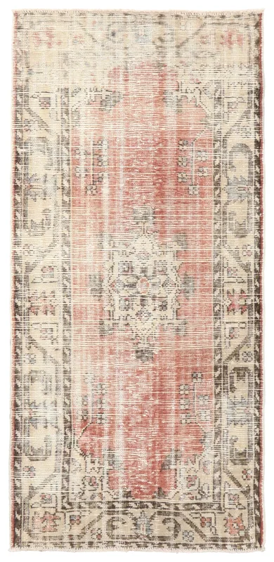 Full overhead view of the vintage rose and beige Anatolian rug on a white background