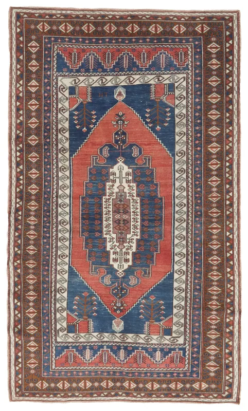 Full top view of the blue and rust geometric Anatolian vintage area rug