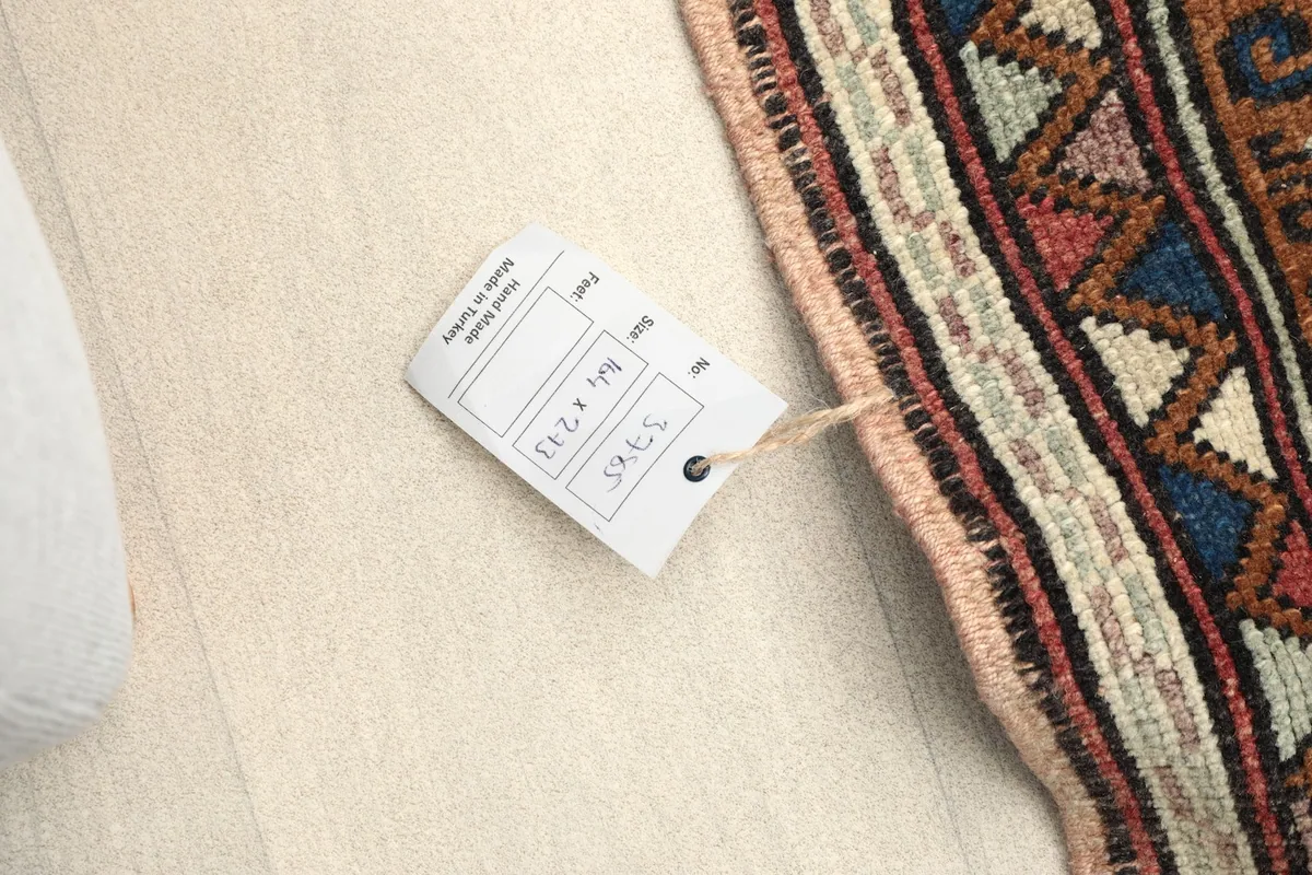 Tag attached to the rug displaying its size and item number