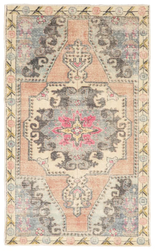 Full top view of the 4x7 rust and blue vintage Anatolian area rug with medallion design