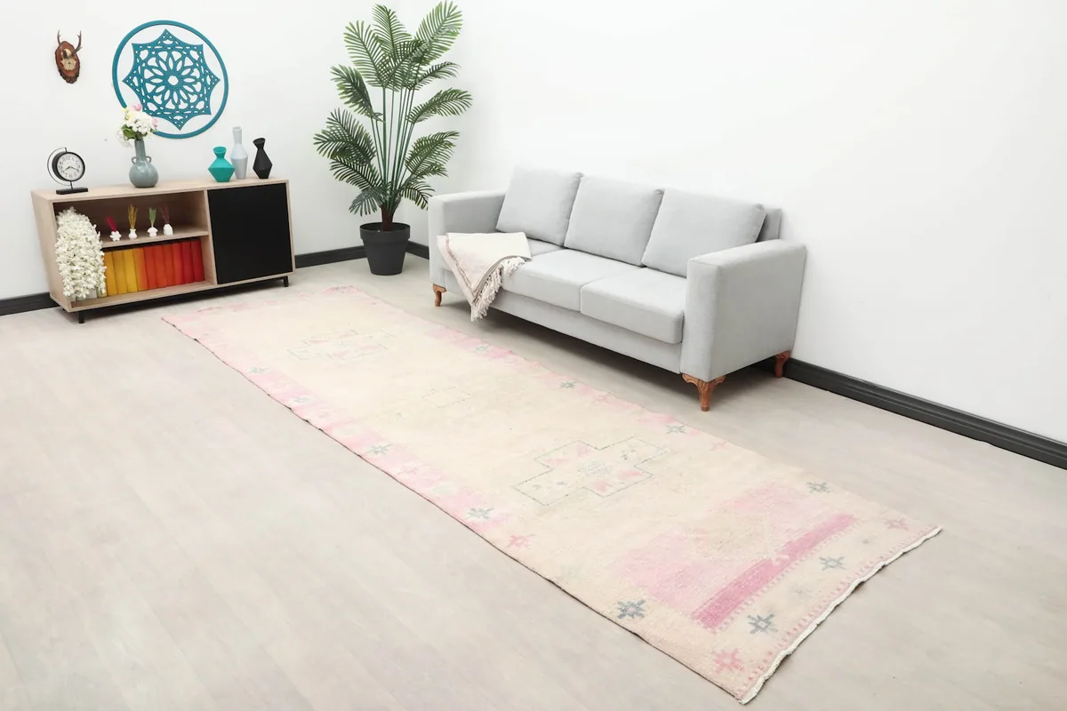 Long shot of the beige and rose runner in a modern living space with minimalist decor