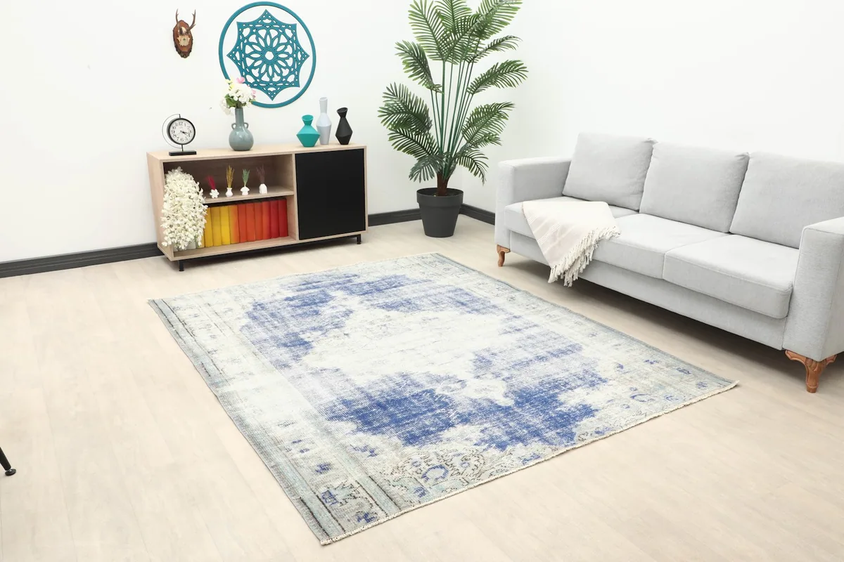 Angle view of the Anatolian rug in a living room, showing its placement relative to furniture