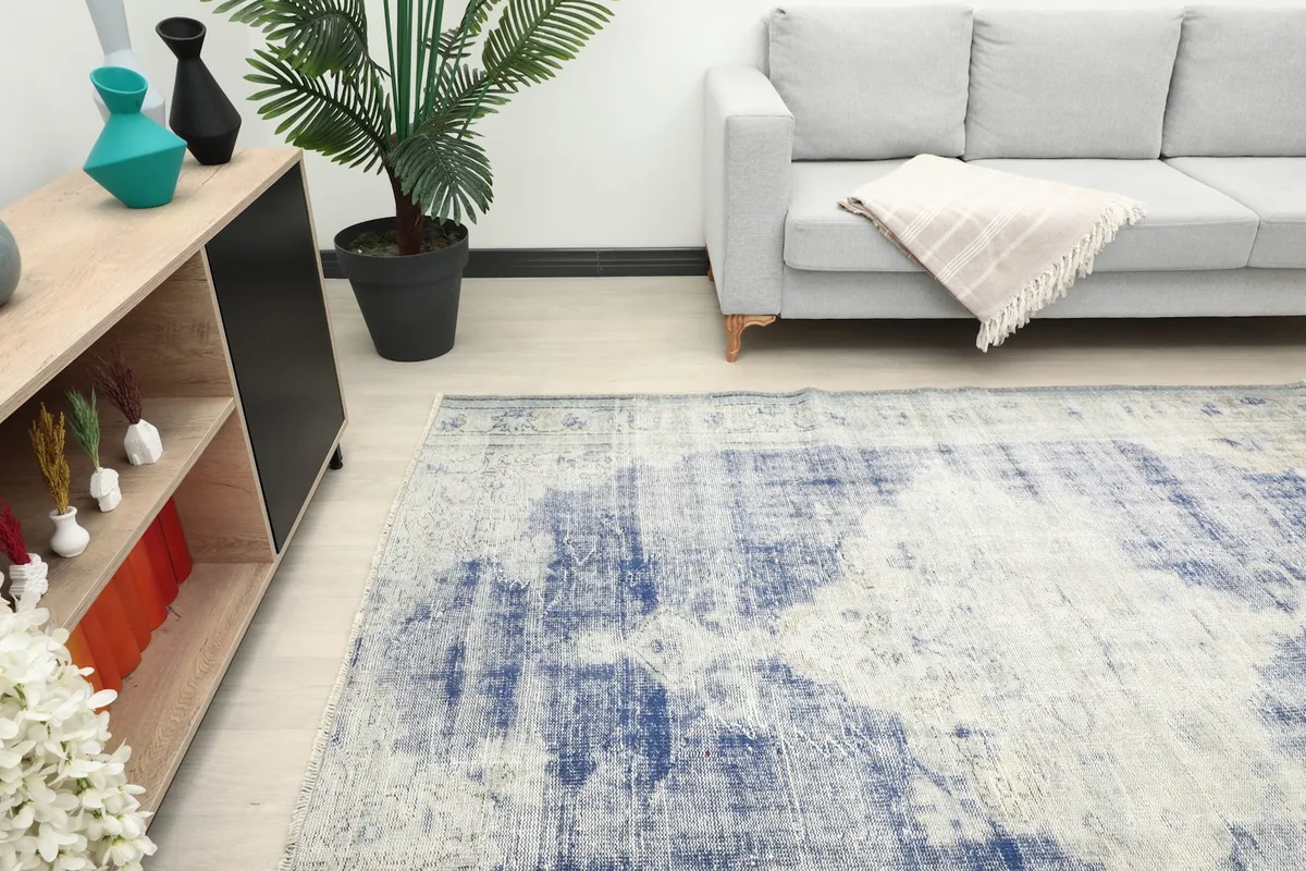Detailed room shot of the rug's texture and colors, complementing the light wood floor