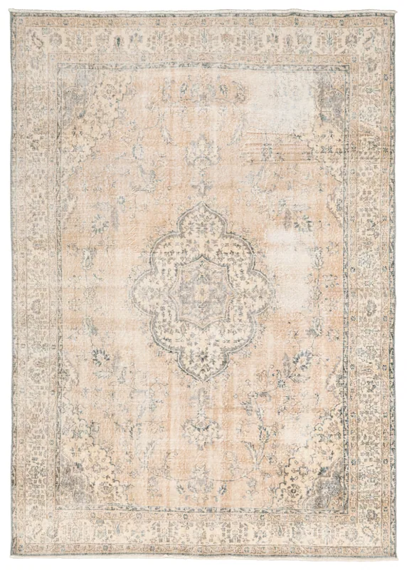 Full top view of the vintage tan Anatolian area rug with an ivory medallion and blue floral patterns