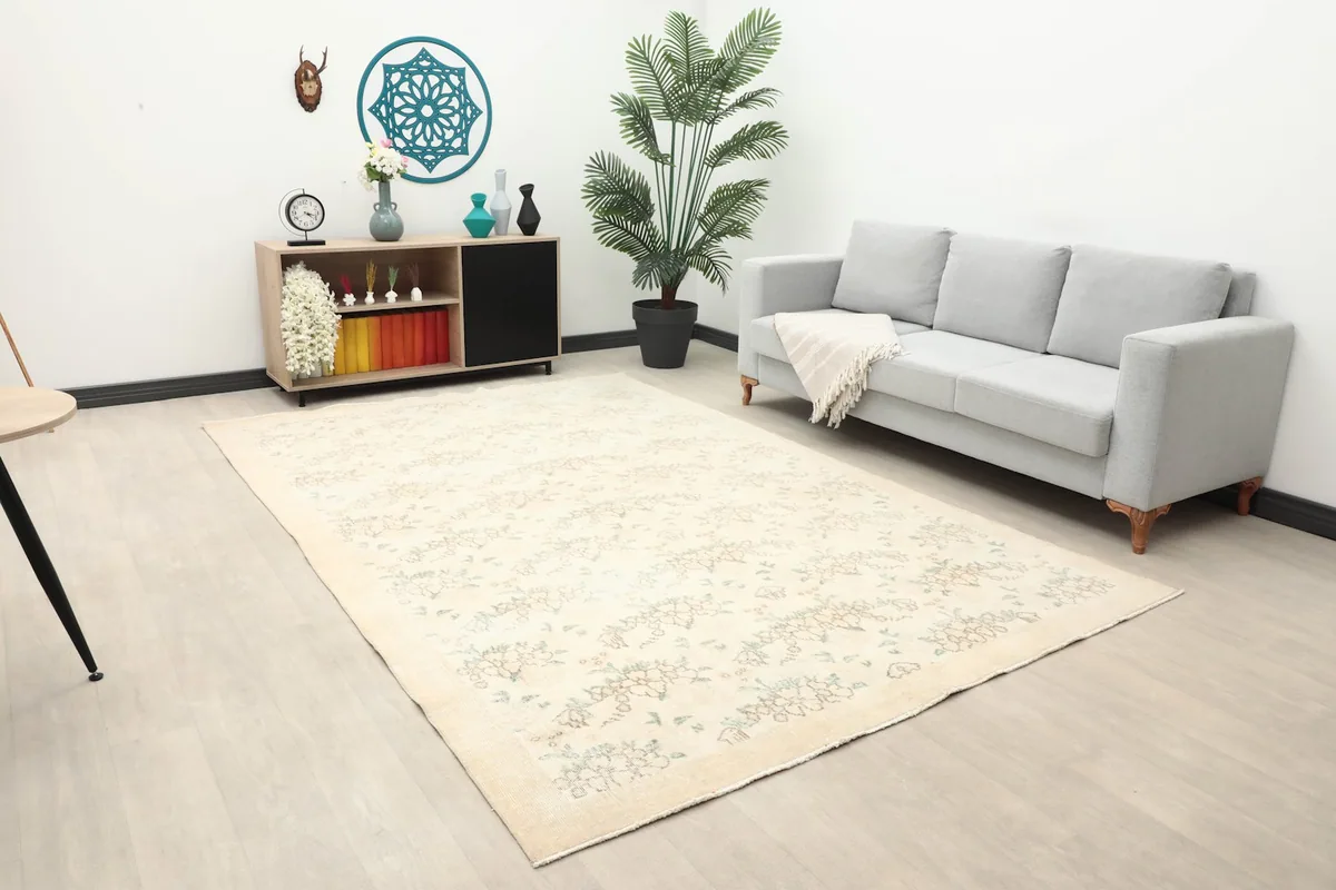 Wide shot of the ivory Anatolian rug in a room, highlighting its placement and scale
