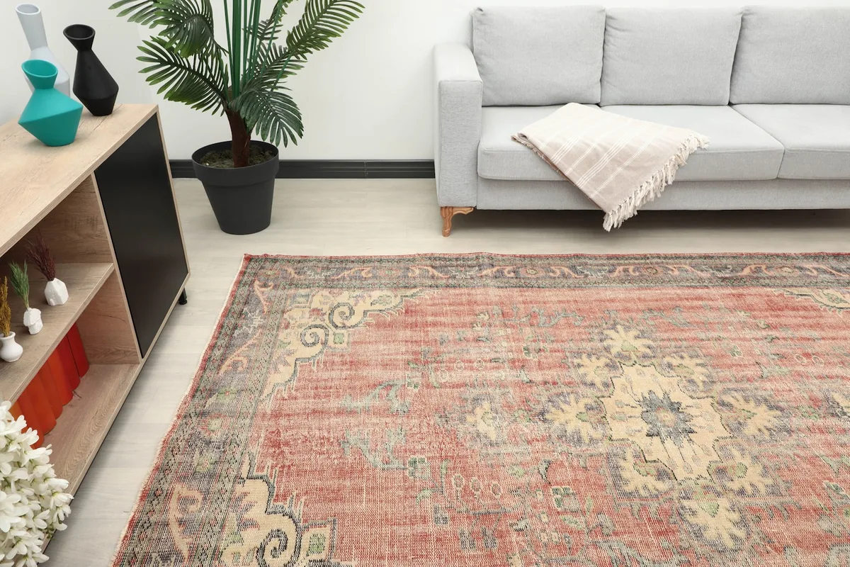 View of the rug in a living room, focusing on the central medallion and room context