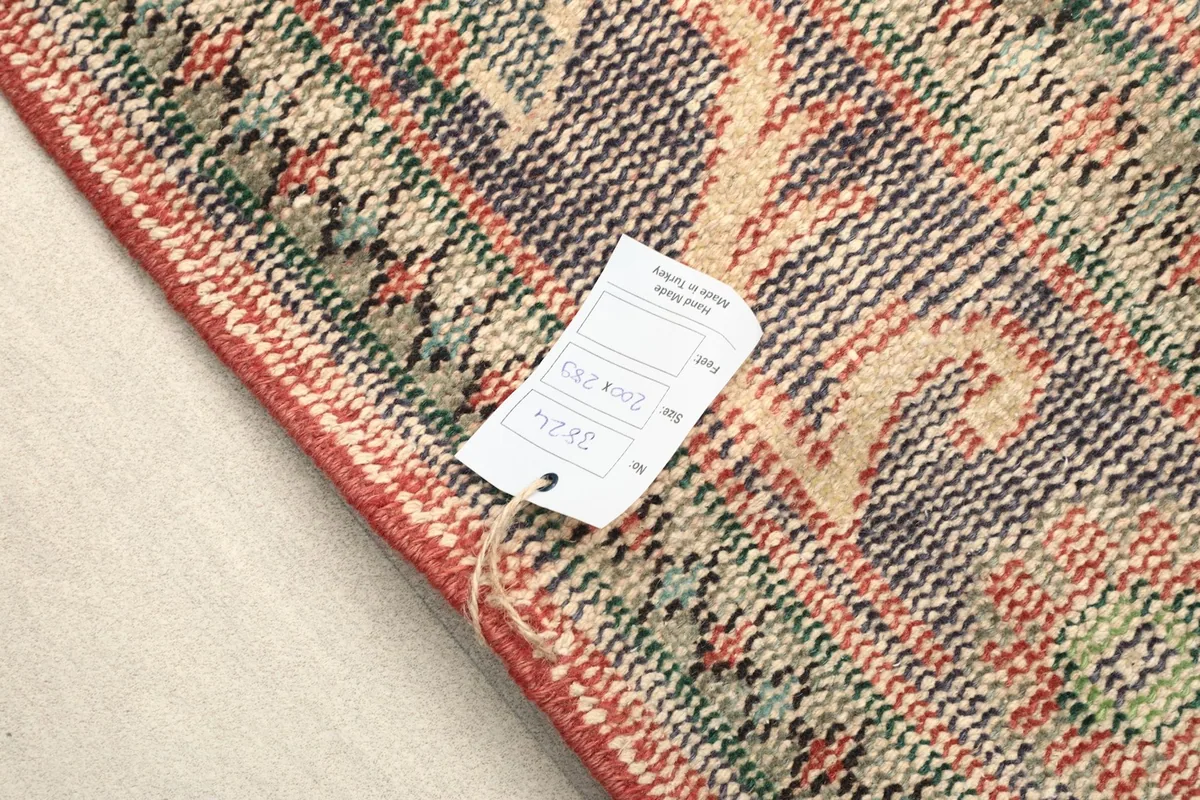 Rug corner with a product tag, showing the origin and material details