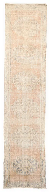 Full overhead view of the 2'7" x 11'11" faded rust and gray vintage Anatolian runner rug.