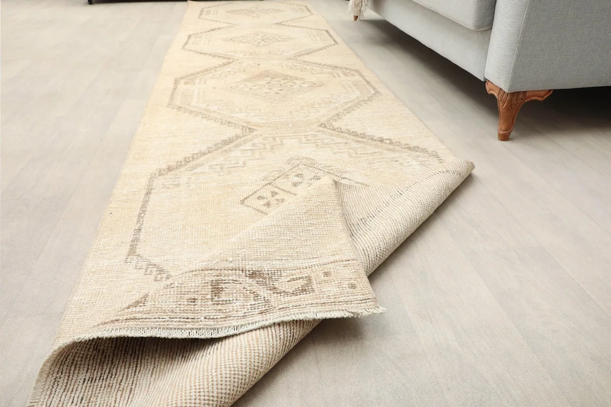 Runner with one end folded back, showing the pile and the rug's flexibility.