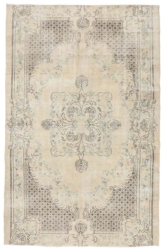 Full top view of the 5'10" x 9'2" vintage Anatolian rug with a tan field and charcoal medallion