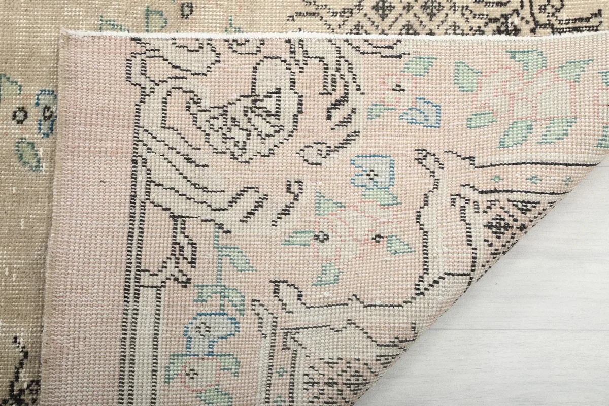 Close-up of the low wool pile and the intricate knotting on the rug's back