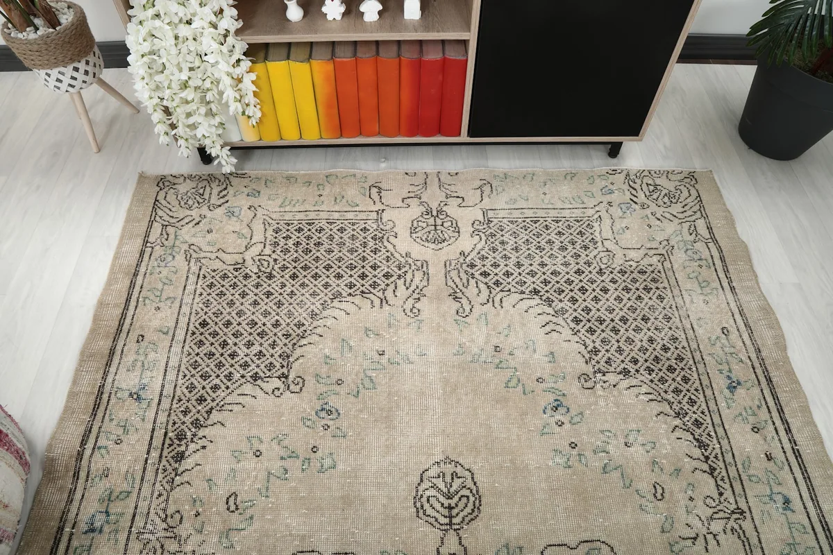 Overhead view of one end of the rug, showcasing the medallion and border patterns