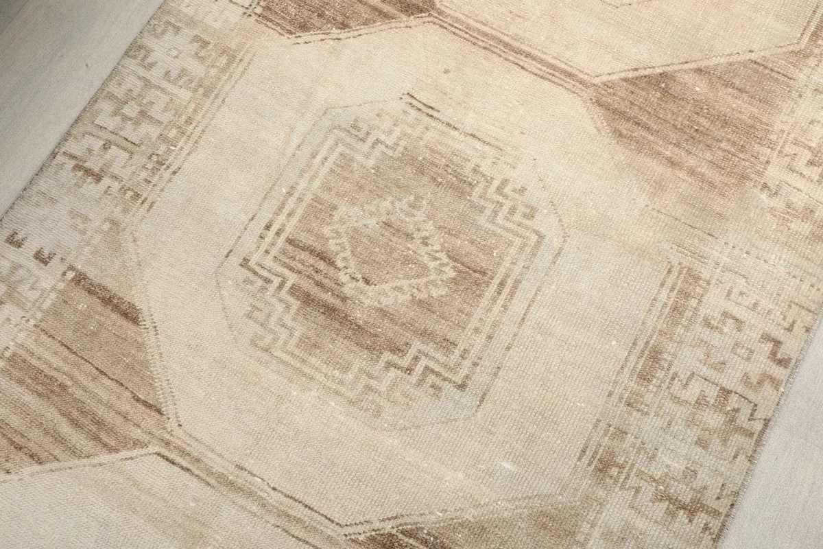 Close-up on a central octagonal medallion motif with intricate geometric designs.