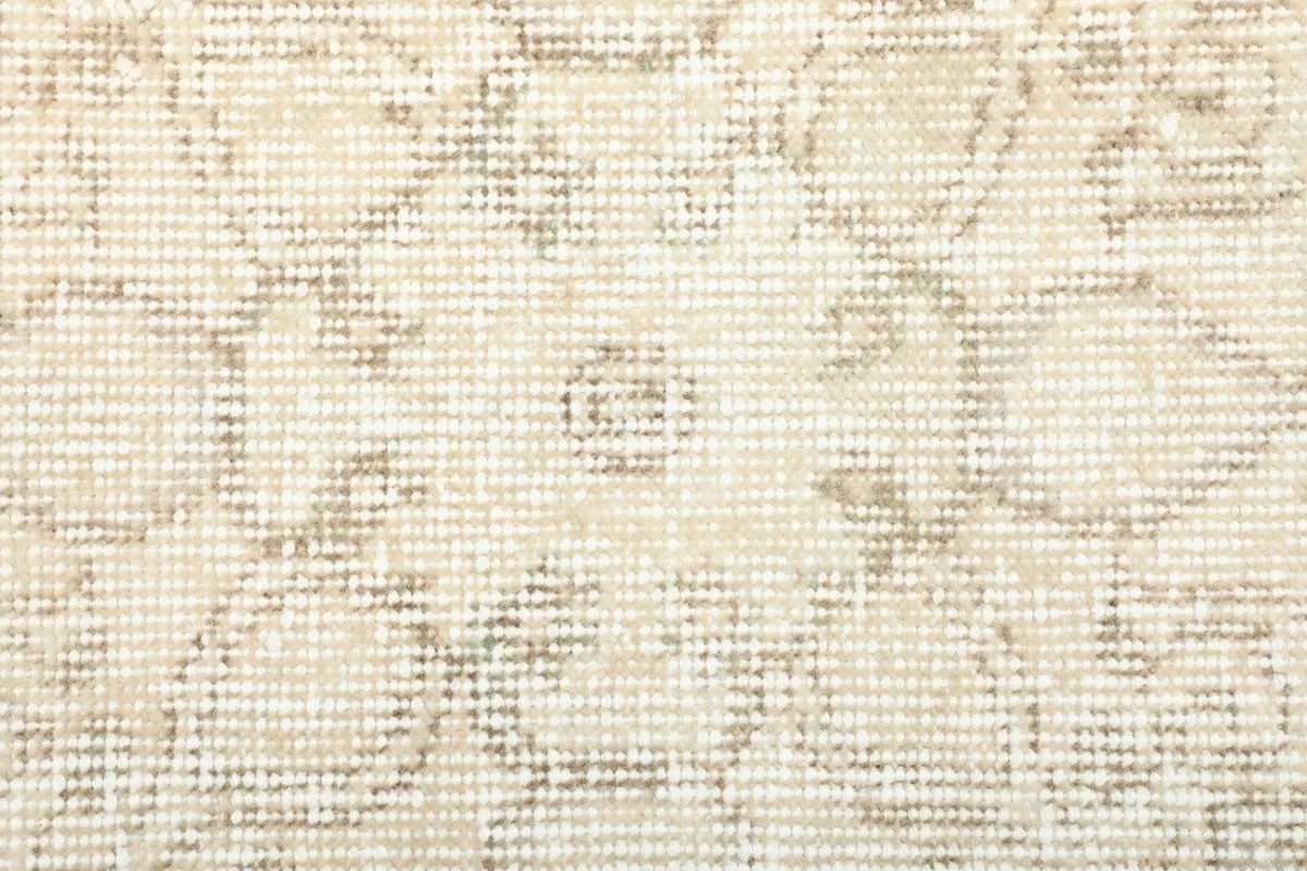 Texture of the low wool pile, showing the hand-knotted weave and subtle color variations