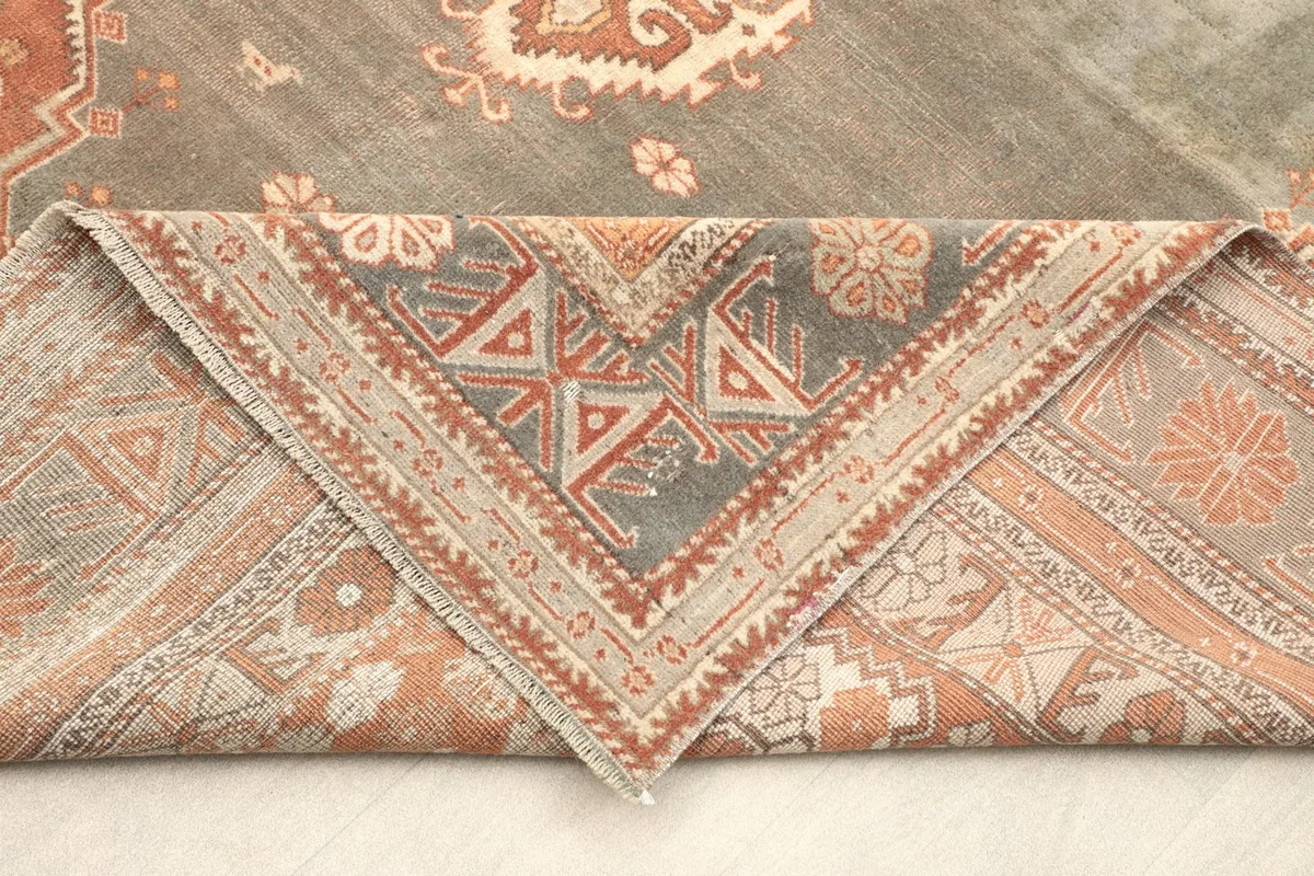 Reverse side of a folded corner, revealing the hand-knotted cotton foundation