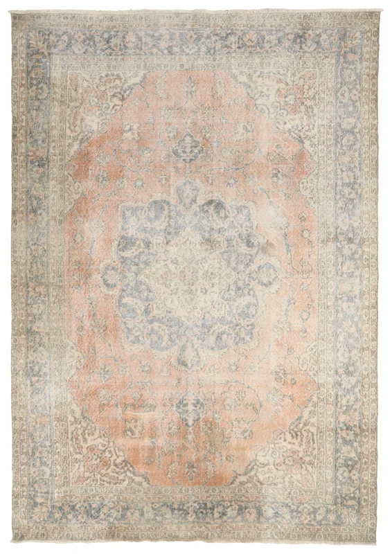 Full overhead view of the orange and blue vintage Anatolian rug on a white background
