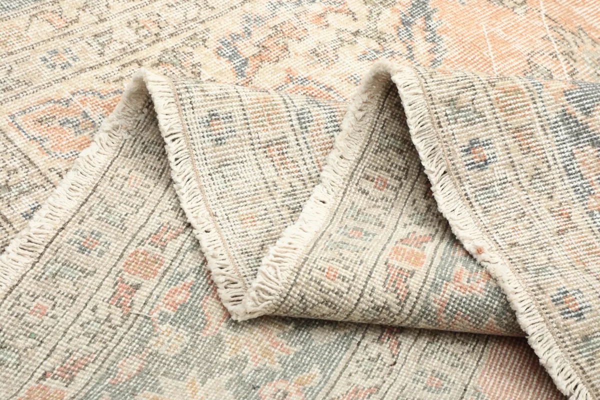 Zigzag fold of the rug showcasing the wool pile and cotton foundation