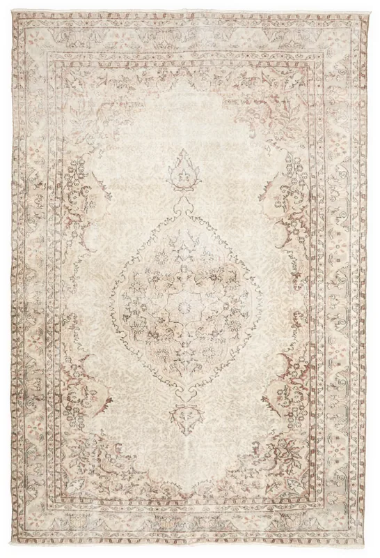 Full top view of the vintage ivory and brown Anatolian area rug on a white background