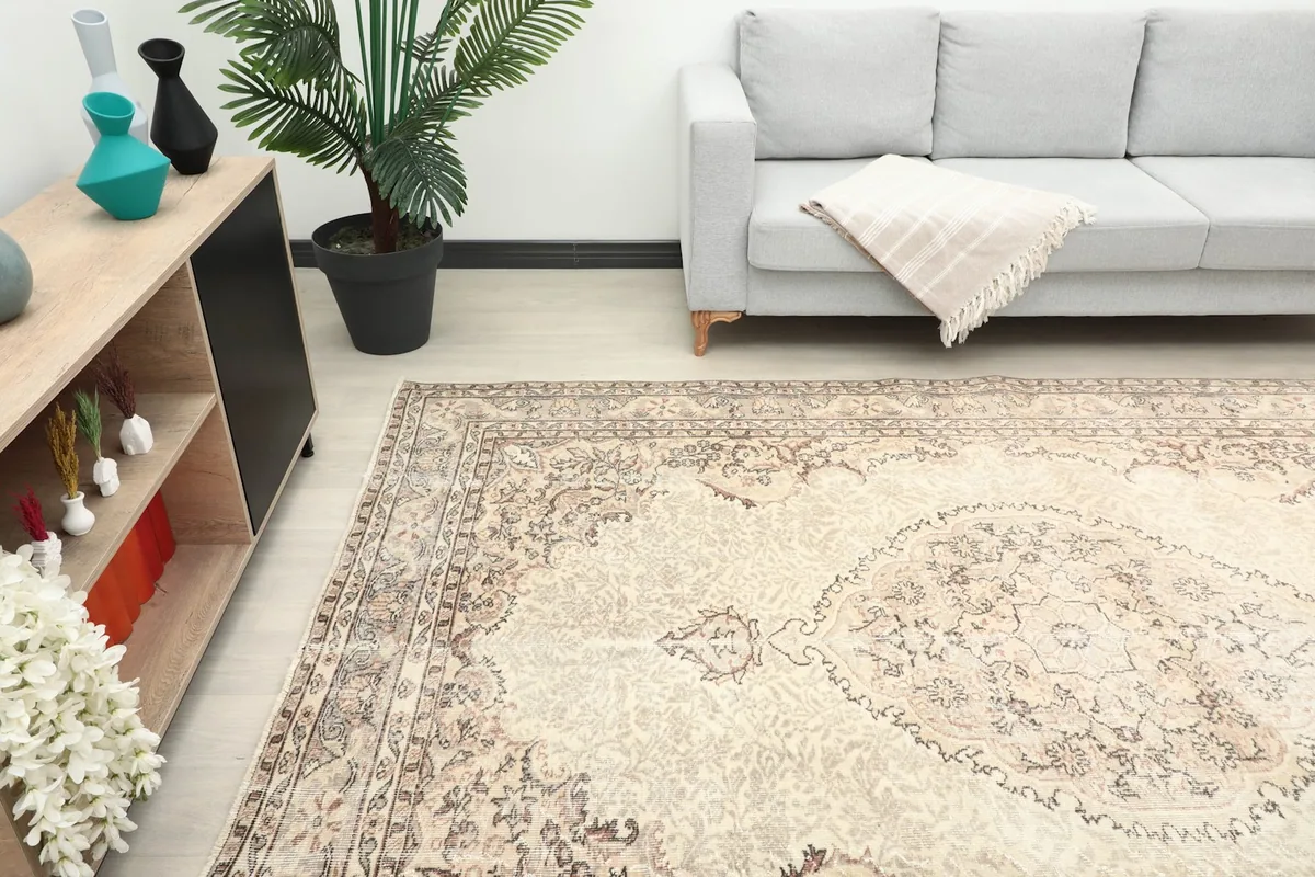 Angle view of the rug in a living room, highlighting the central medallion and overall pattern