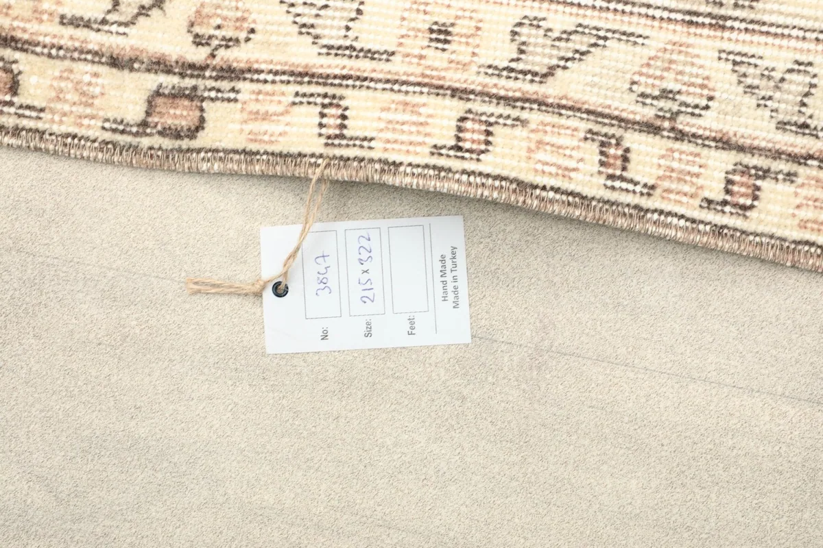 Close-up of the product tag indicating rug size and hand-made origin from Turkey
