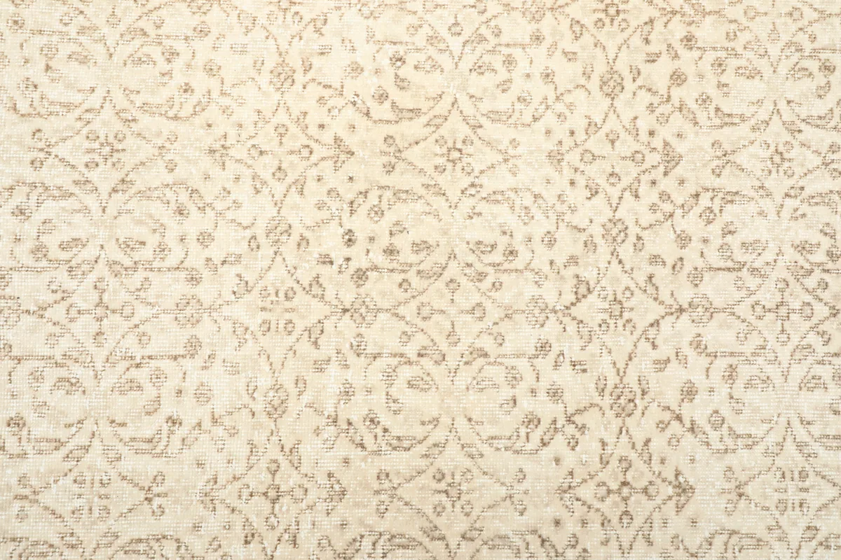 Detailed view of the subtle floral pattern and color variation within the Subtle Beige Floral Anatolian Rug.