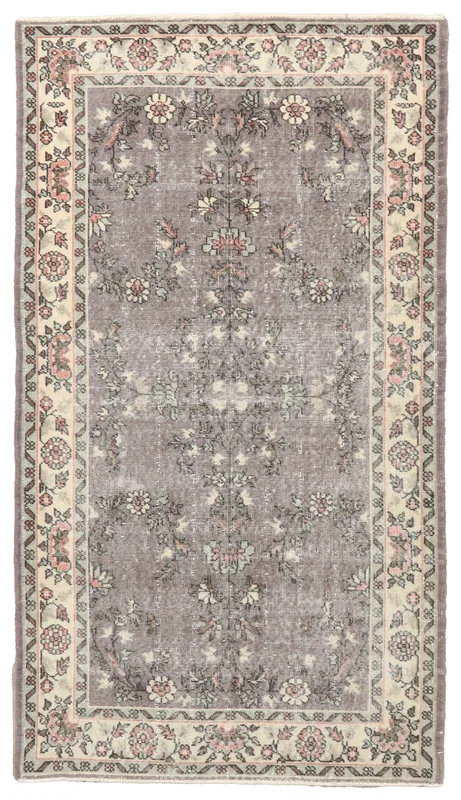 Full overhead view of the 3'11" x 7'1" vintage purple floral Anatolian rug on a white background.