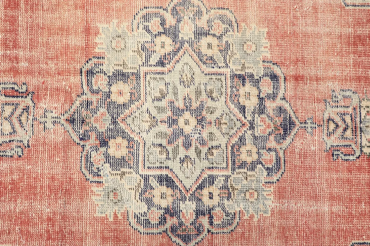 Detailed view of the central medallion with its intricate floral and geometric motifs