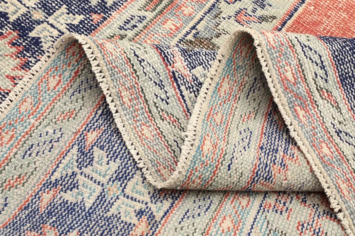 Folded section of the rug, displaying the density of the knots and craftsmanship