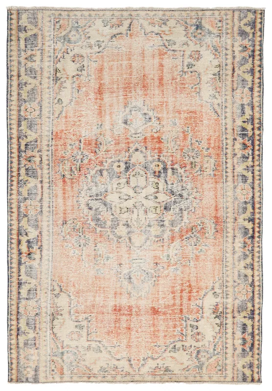 Full overhead view of a vintage rust, navy, and beige Anatolian medallion rug