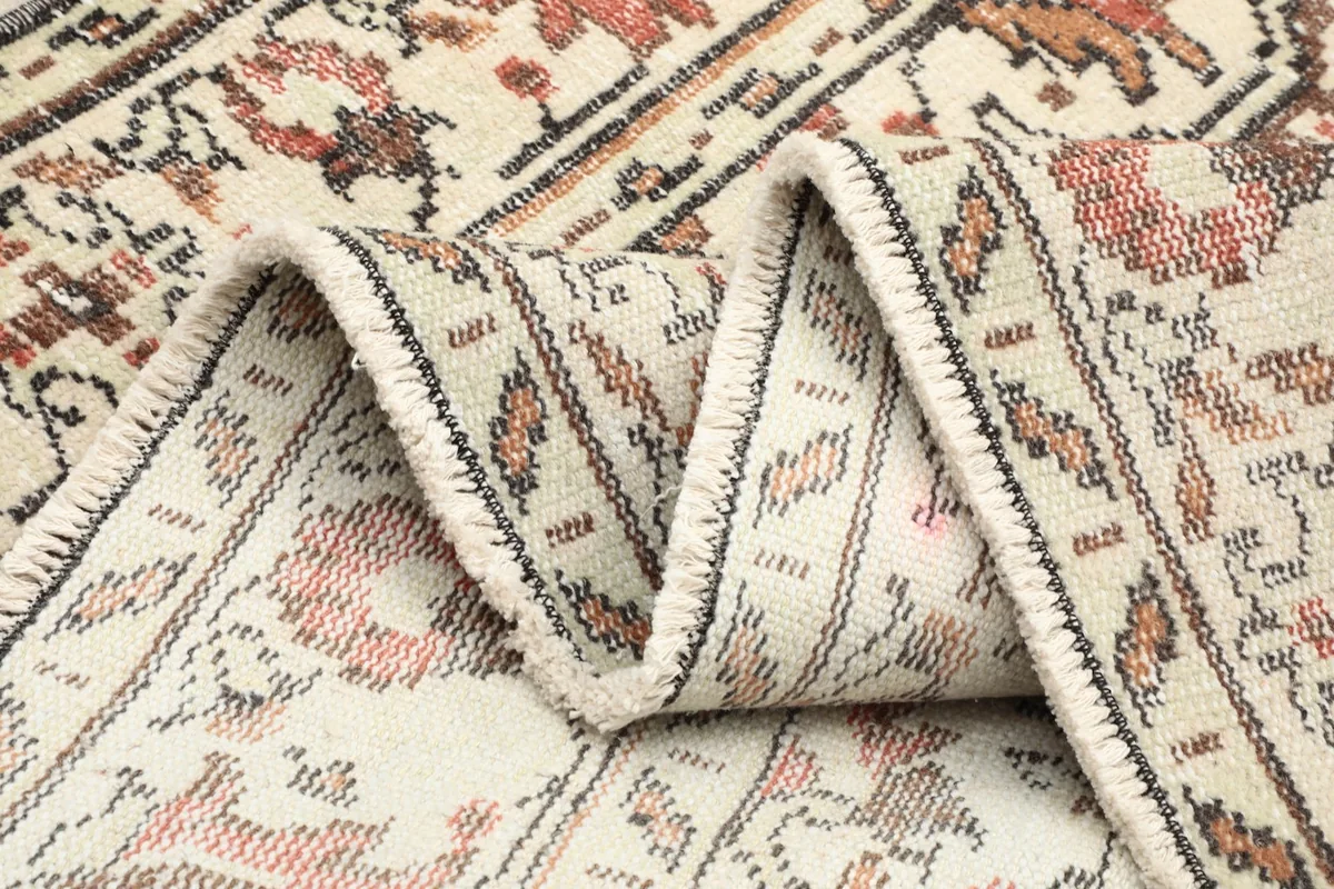 Close-up of the back of the rug, revealing the hand-knotted construction and tight weave.