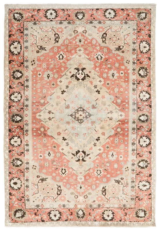 Full overhead view of the vintage Anatolian rose and ivory medallion area rug