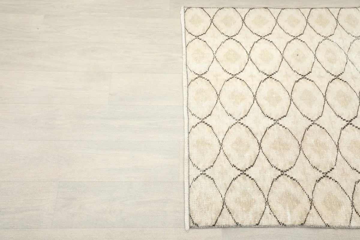 Overhead view of the other side of the rug, showcasing the charcoal design