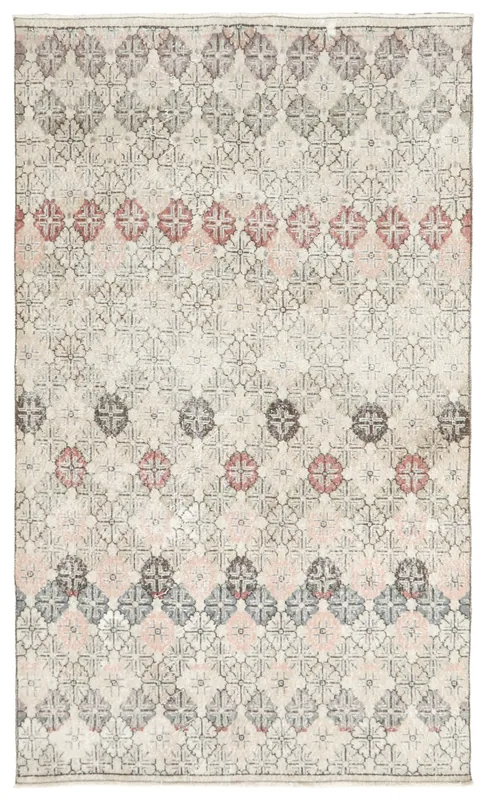Full top view of the beige vintage Anatolian rug with tiled floral patterns
