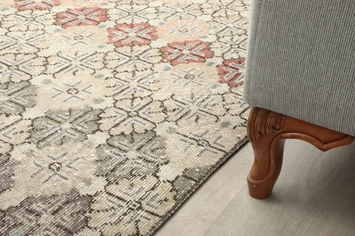 Rug positioned under a sofa, showing how it complements furniture