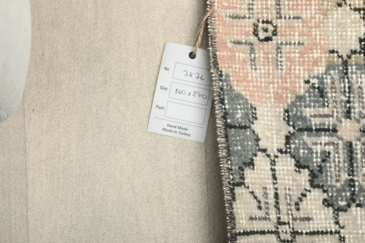 Product tag attached to the rug, displaying size information and origin