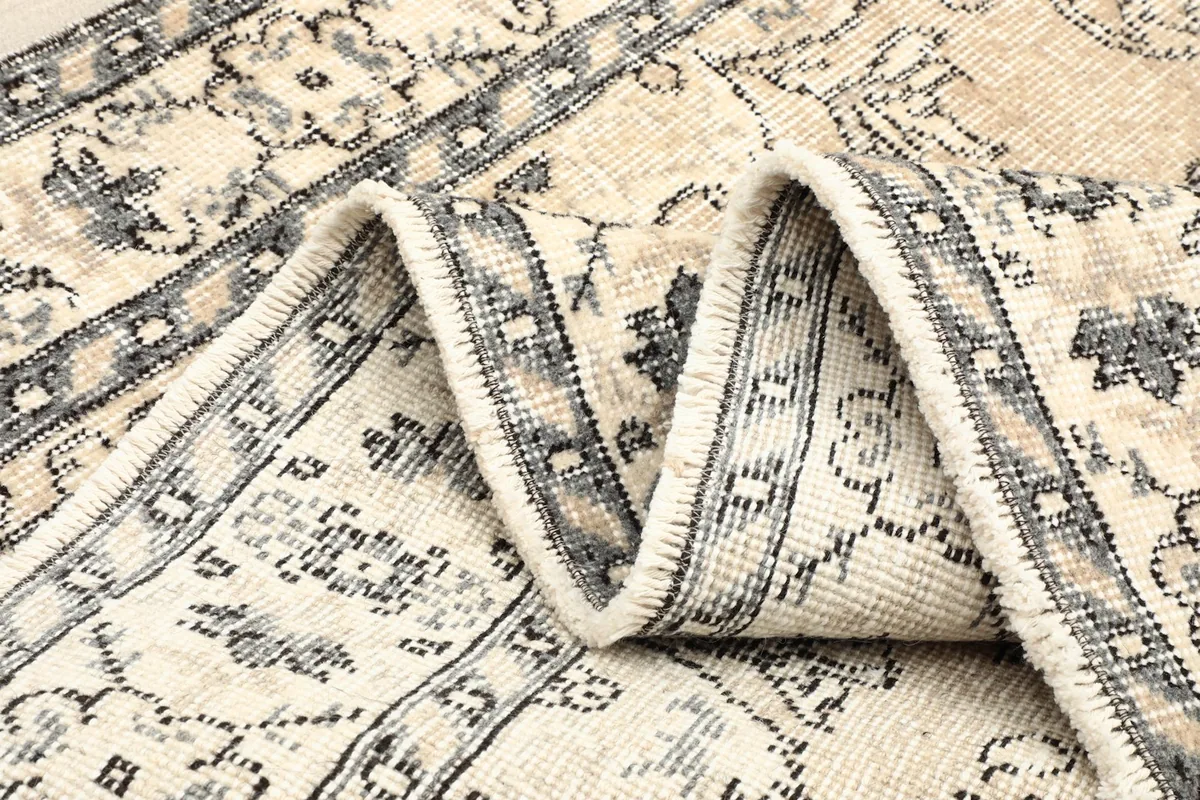 Wavy fold showing the texture and pattern continuity of the rug