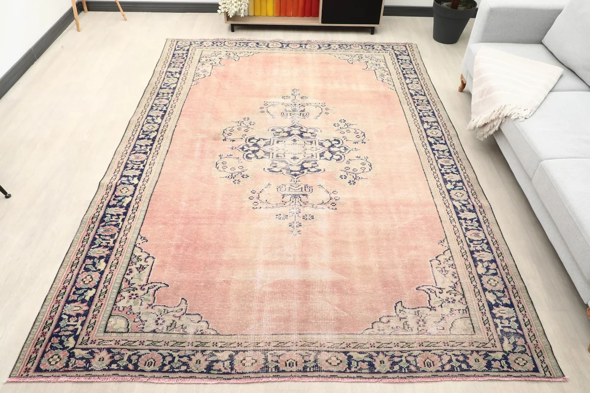 Vintage Anatolian rug in a living room setting, showcasing its full size and colors