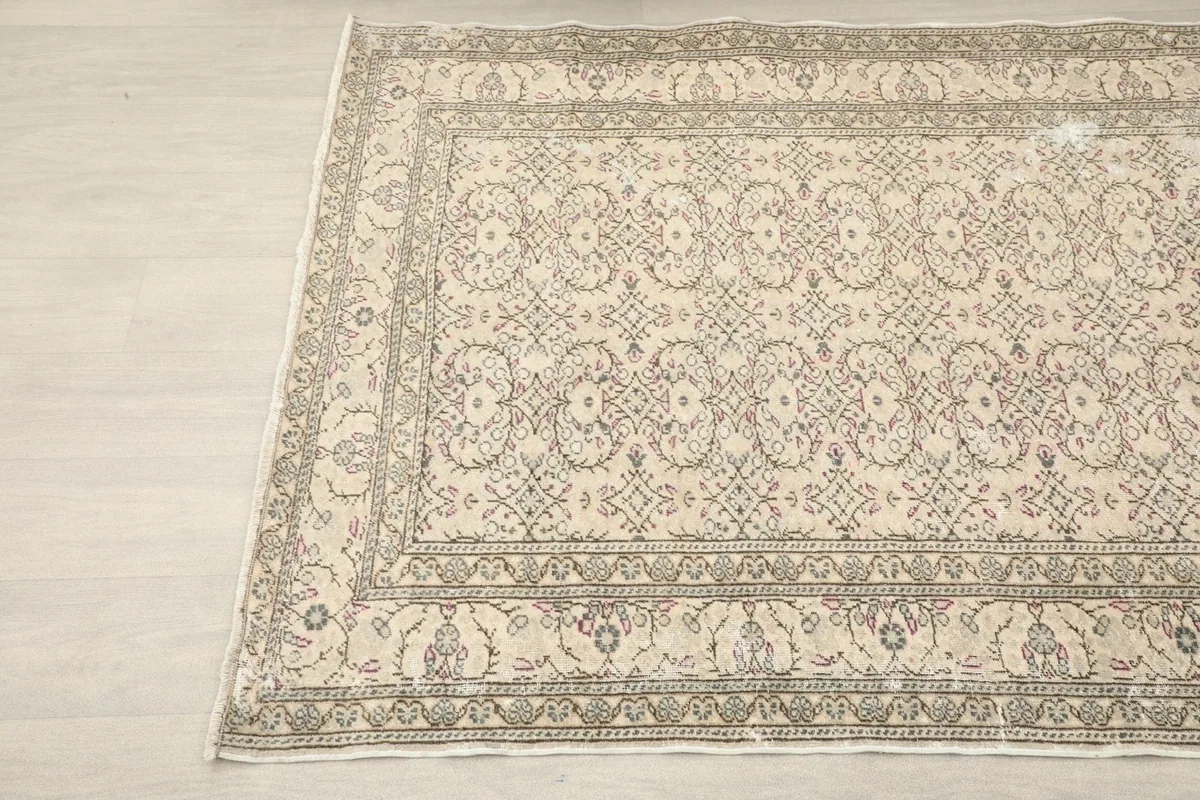 Diagonal view showing the full pattern and colors of the ivory and gray Anatolian rug