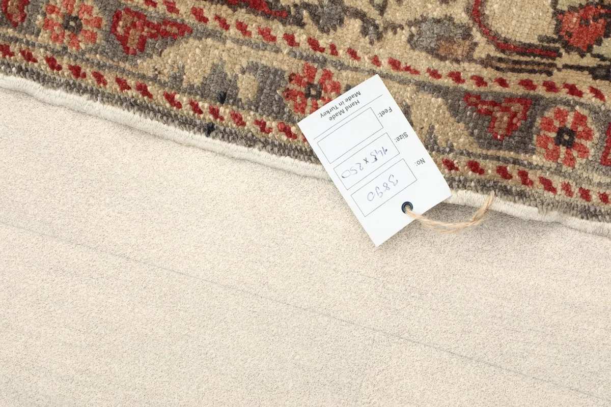 Close-up of the rug with a product tag displaying item information