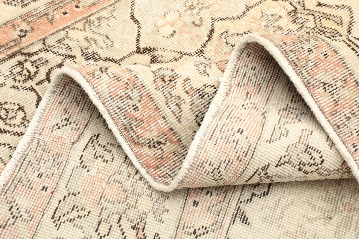 Side of the rug folded showing the thickness and craftsmanship