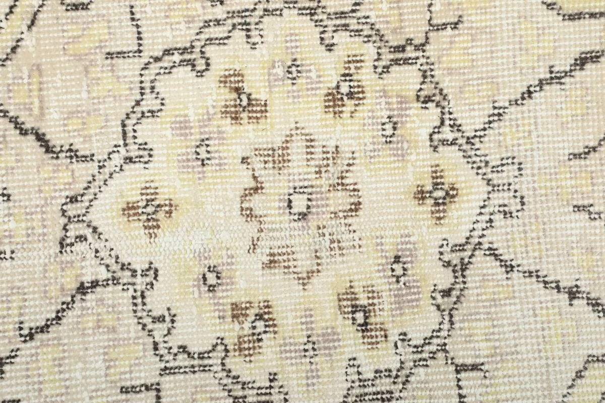 Close-up of the hand-knotted wool pile, showing texture and color variations