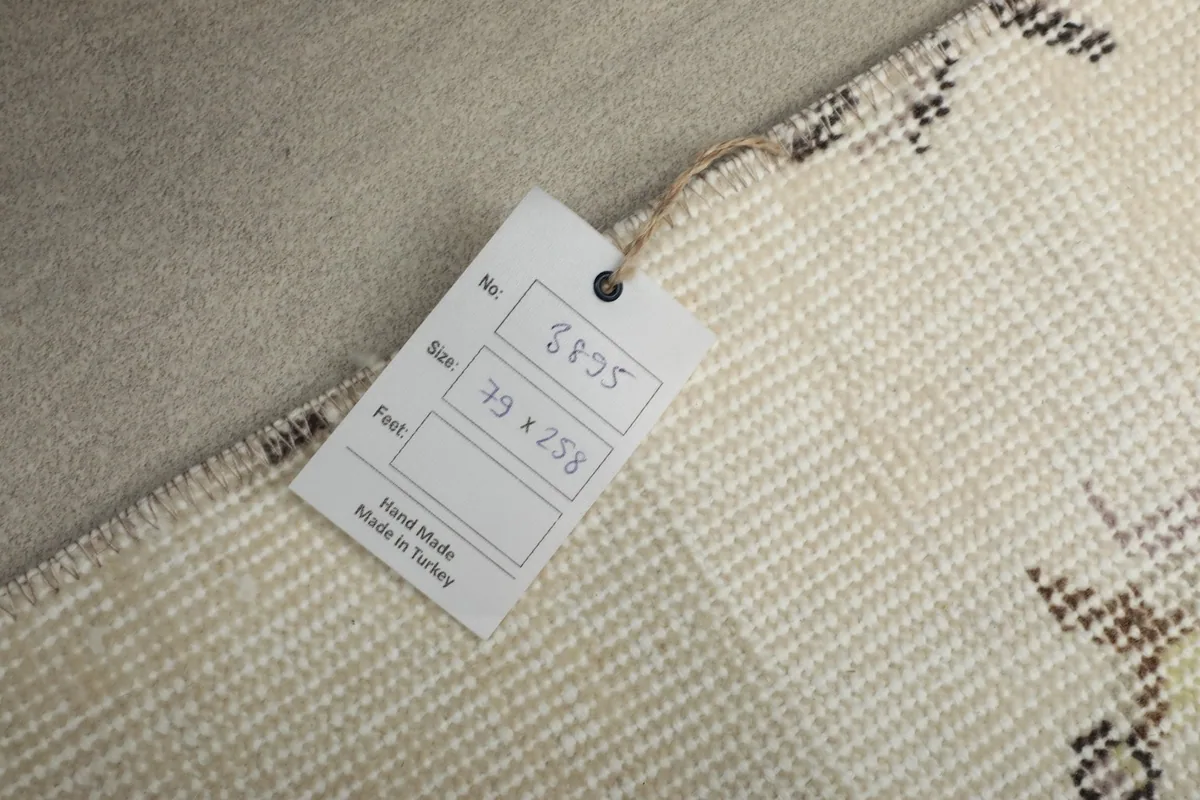 Tag on the back of the rug indicating size and origin 'Hand Made in Turkey'