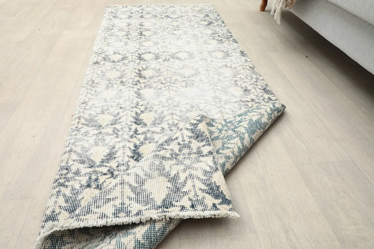 The runner rug folded to show both the top pattern and the sturdy foundation.