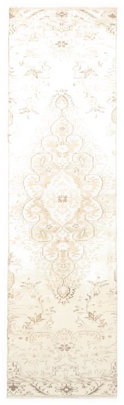 Full overhead view of the vintage ivory and tan Anatolian runner rug