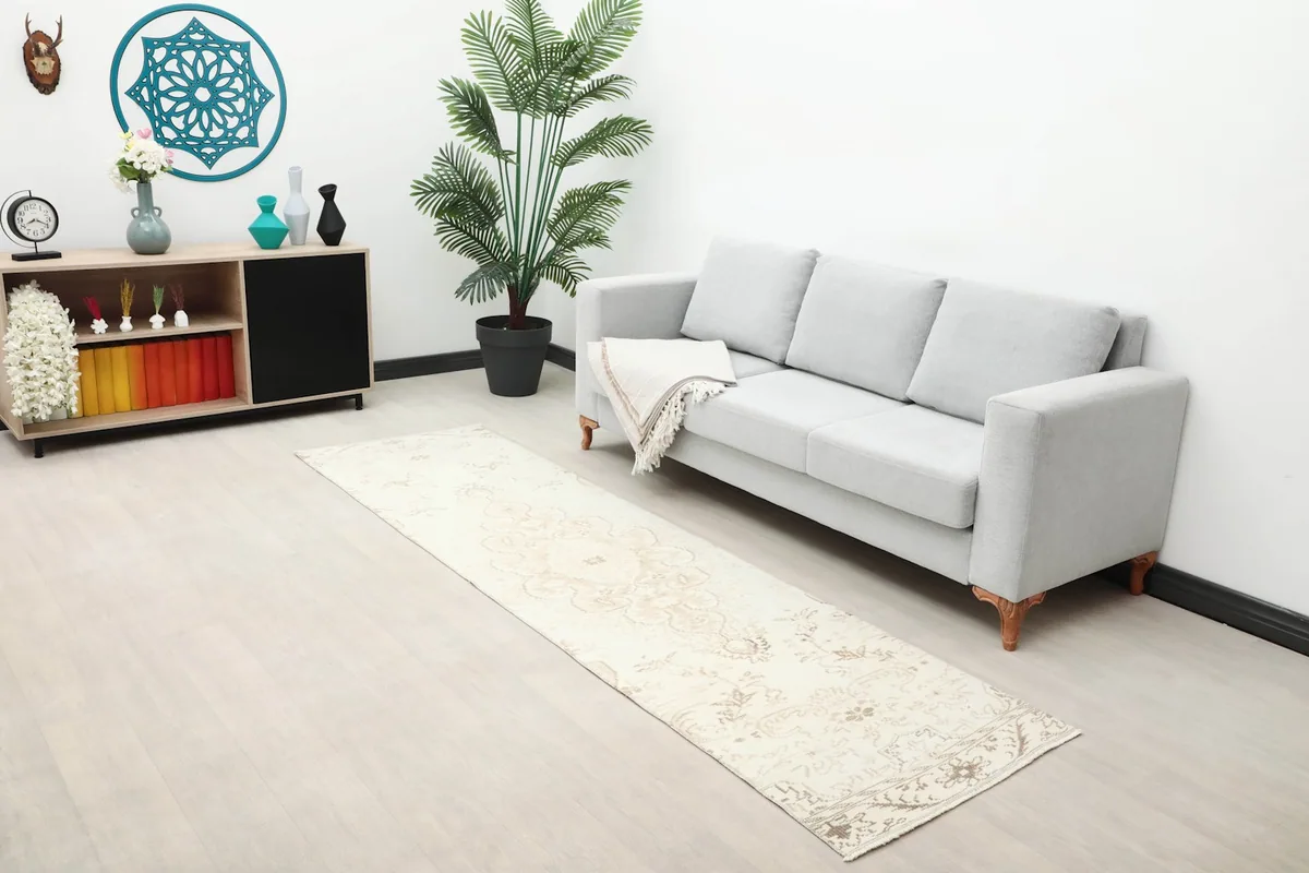 Long view of the ivory and tan runner rug in a contemporary room setting