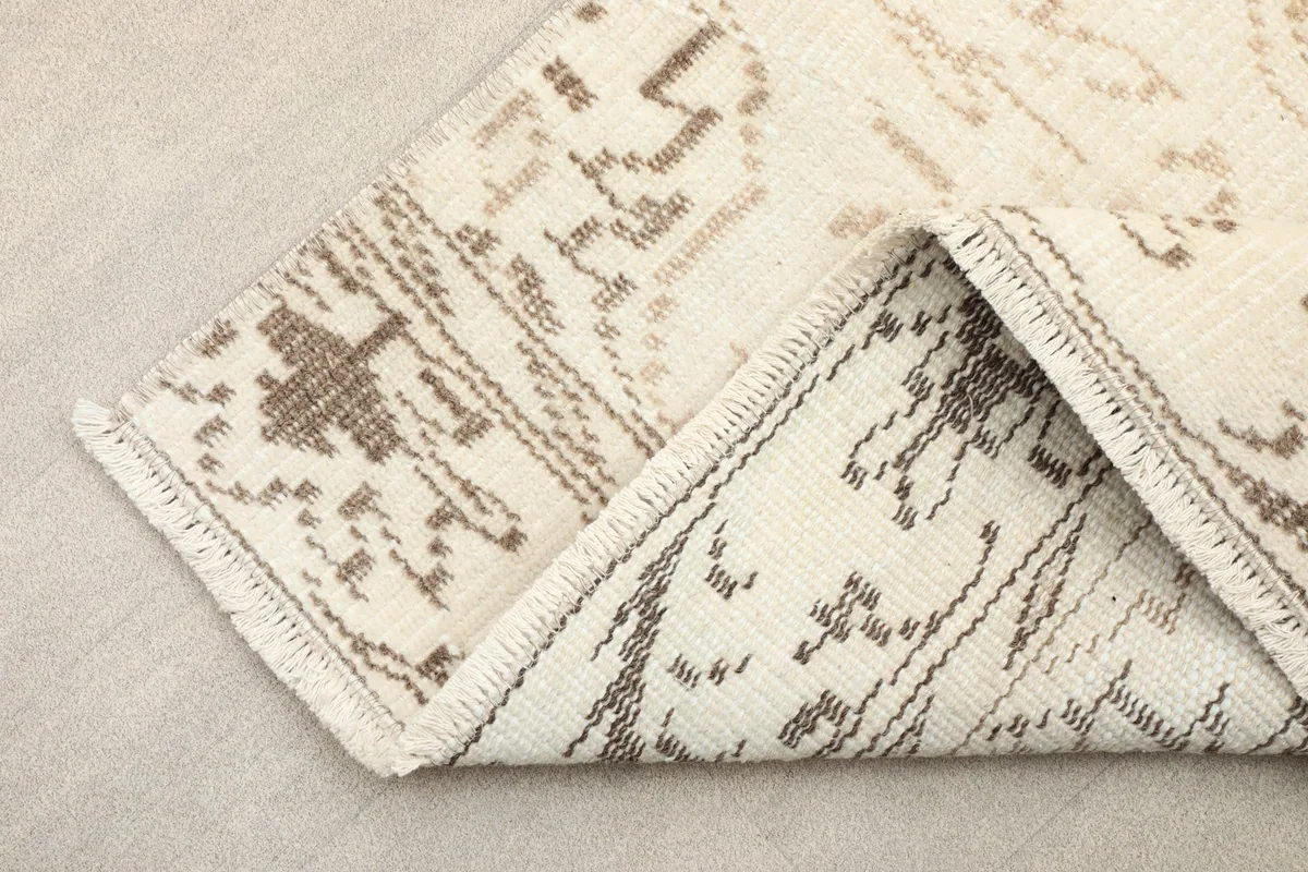 Reverse side of the rug displaying the intricate hand-knotting and foundation
