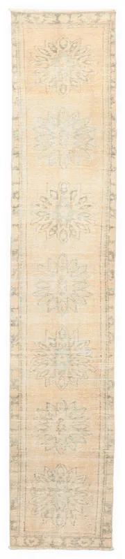 Full top view of the 2'1" x 10'9" beige and gray vintage Anatolian runner on a white background